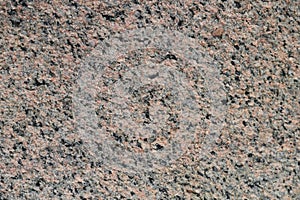 He texture of natural stone is brown granite
