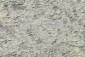 Texture of natural stone gray. Background stone with a shallow relief