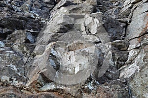 Texture of natural stone rock, background wallpaper white, gray and black splashes on the surface. Horizontal