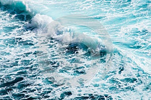 Texture of the Ocean. Natural Background blue waves of the sea with sea foam