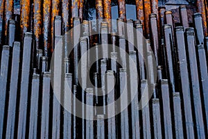 Texture oil drill pipe. Rusty drill pipes were drilled in the well section. Downhole drilling rig. View of the shell of drill