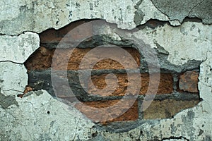 Texture of an old brick wall of an abandoned house.