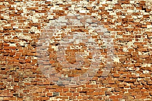 Texture of an old brick wall. Chipped bricks.