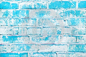 Texture of an old brick wall. Grunge blue stone wall background. Old masonry, shabby facade. Vintage brick wall
