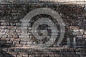 Texture of old brown laterite stone vintage wall