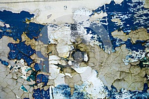 Texture of old concrete wall with many peeled paint layers