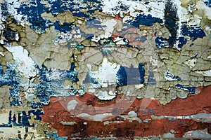 Texture of old concrete wall with many peeled paint layers