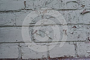 Texture: old cracked brick wall painted in paint. Brick wall texture