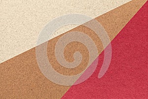 Texture of old craft beige, brown and red color paper background, macro. Structure of vintage abstract cardboard