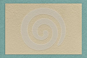 Texture of old craft beige color paper background with blue border. Vintage kraft cerulean and brown cardboard