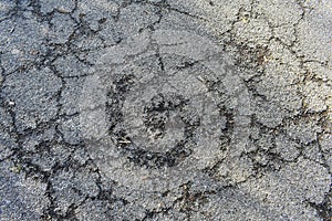 Texture of old gray cracked asphalt.