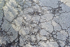 Texture of old gray cracked asphalt.