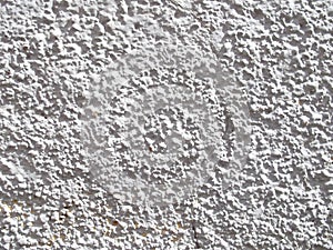 The texture of an old gray wall in the sunlight