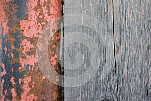 Texture of an old natural wooden planks and rusty metal pipes c