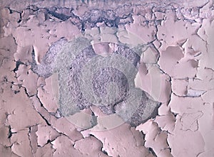 The texture of the old paint peeling on the stone wall. Background of exfoliation dye.