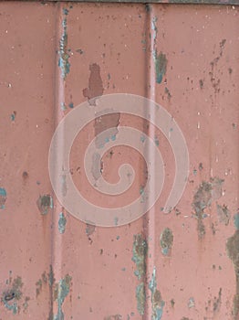 Texture of old painted rusty metal with faded peeling paint.