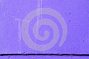 Texture of an old painted wall of purple color. Abstract background