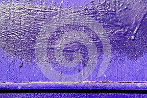 Texture of an old painted wall of purple color. Abstract background
