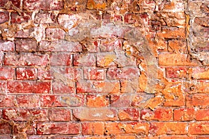 Texture of old red brick wall surface with cement seams