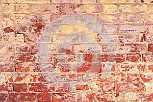 The texture of old red and yellow brick wall. Close-up, pattern