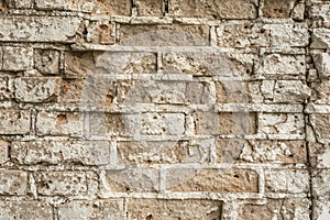 Texture of an old ruined brick wall of an ancient building