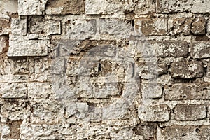 Texture of an old ruined brick wall of an ancient building