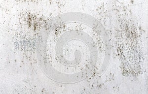 Texture of an old, rusty and scratched metal sheet once covered with white paint