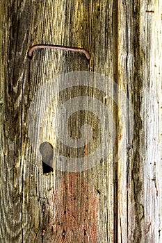 Texture of old vertical wooden planks with lock and handle photo