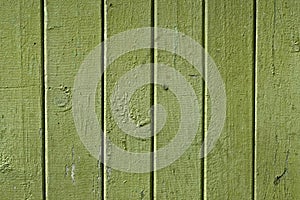Texture of the old vintage wooden boards painted in green