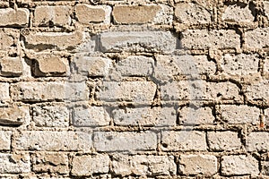 Texture of the old wall of brick blocks, scattered brick and brickwork, architecture abstract background