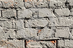 Texture of the old wall of brick blocks, scattered brick and brickwork, architecture abstract background