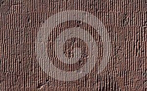 Texture of old wall covered with brown stucco