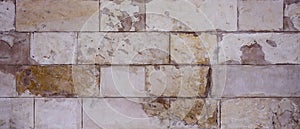 The texture of the old wall of large bricks.