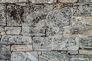 The texture of the old wall. Vintage brick back. The wall is made of shell rock of various rectangular shapes