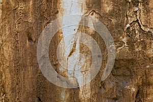 The texture of an old and weathered adobe wall