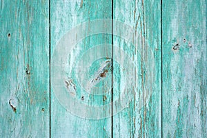 Texture of old wood rustic background with peeling light green paint. Horizontal