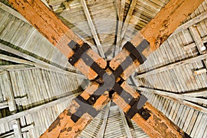 The texture of the old wooden ancient fat people strong beams, log and ceilings under the ceiling. The background