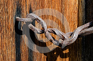 Texture of old wooden door with rusty inserts