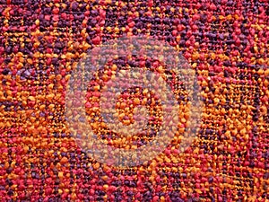 Texture of orange purple fabric, close up of wool structure, wallpaper background.