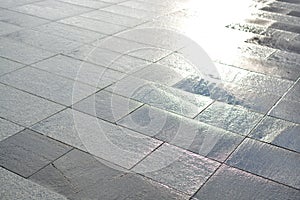 Texture of outdoor floor tiles. Wet outdoor tile after the rain
