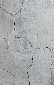 Texture of painted plasterwork with multiple cracks