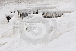 Texture of Pamukkale famous blue travertine pools and terraces