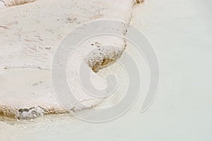 Texture of Pamukkale famous blue travertine pools and terraces