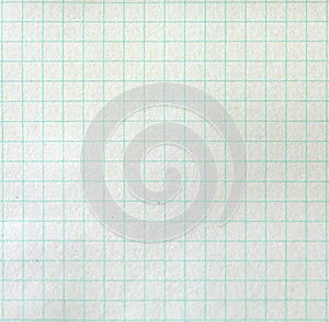 The texture of the paper background. Blank sheets of square and lined paper from a block on a gray background.