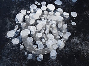 Texture pattern background white Winter, river ice air bubbles stagnant. drawing on ice frost formed. Severe cold frozen water. a