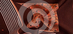 Texture, pattern, collection, silk fabric, brown background with a striped pattern of white and red lines, the Spanish theme,