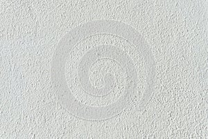 Texture and pattern of light gray plaster on an empty wall