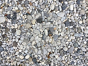 Texture pattern of pebbles gravel and small stones in walk way path
