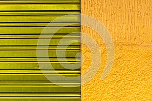 Texture pattern of purpple iron door of closed store and yellow wall