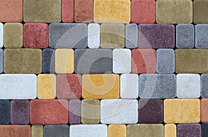 The texture of the paving stones wall of different colors for construction. Facing building material